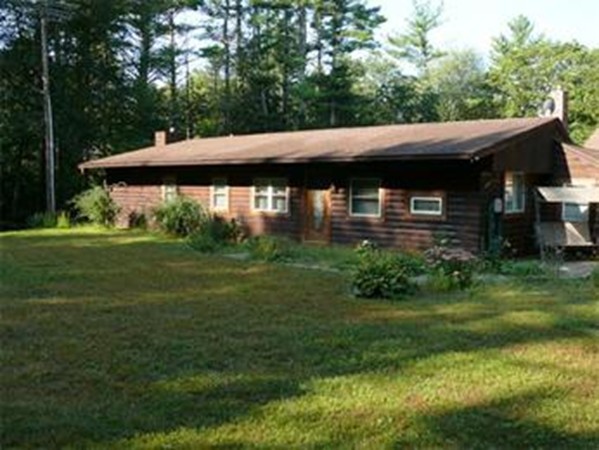 188 Mason Road Townsend, MA 01474 - Photo 1 of 22 a backyard of a house with a garden and plants