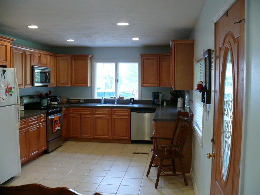 188 Mason Road Townsend, MA 01474 - Photo 5 of 22 a kitchen with stainless steel appliances granite countertop sink refrigerator and window