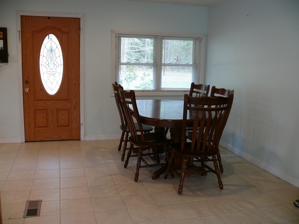 188 Mason Road Townsend, MA 01474 - Photo 8 of 22 a view of a dining room with furniture and a window