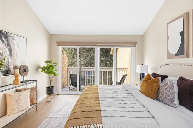 a spacious bedroom with a large bed and a large window