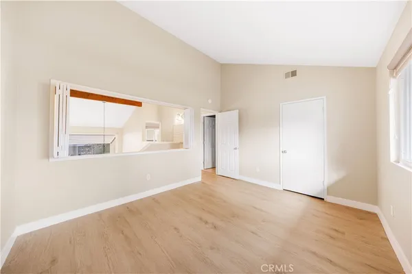 a view of an empty room with a window