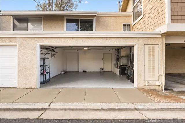 a view of a house with a parking area