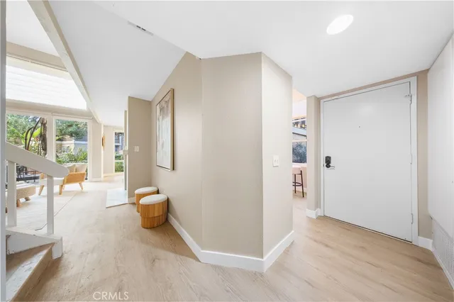 a view of a livingroom with furniture and front door