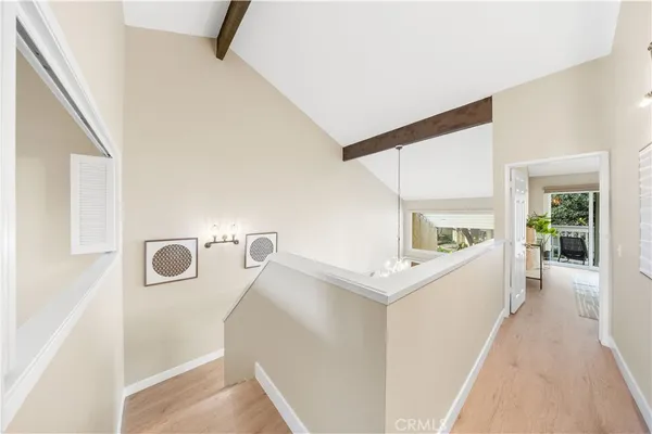 a view of a hallway with washer and dryer