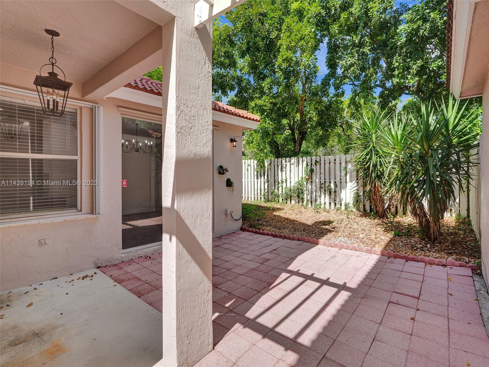 4185 Tree Top Road Cooper City, FL 33026 - Photo 28 of 36 a view of a house with backyard and sitting area
