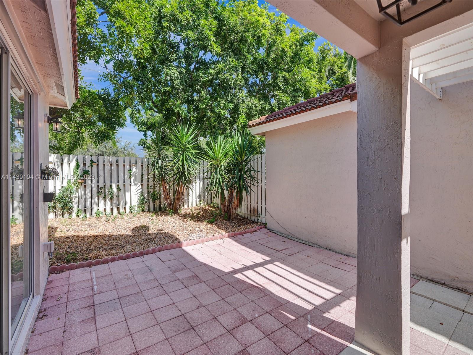 4185 Tree Top Road Cooper City, FL 33026 - Photo 29 of 36 a view of a backyard with a small cabin