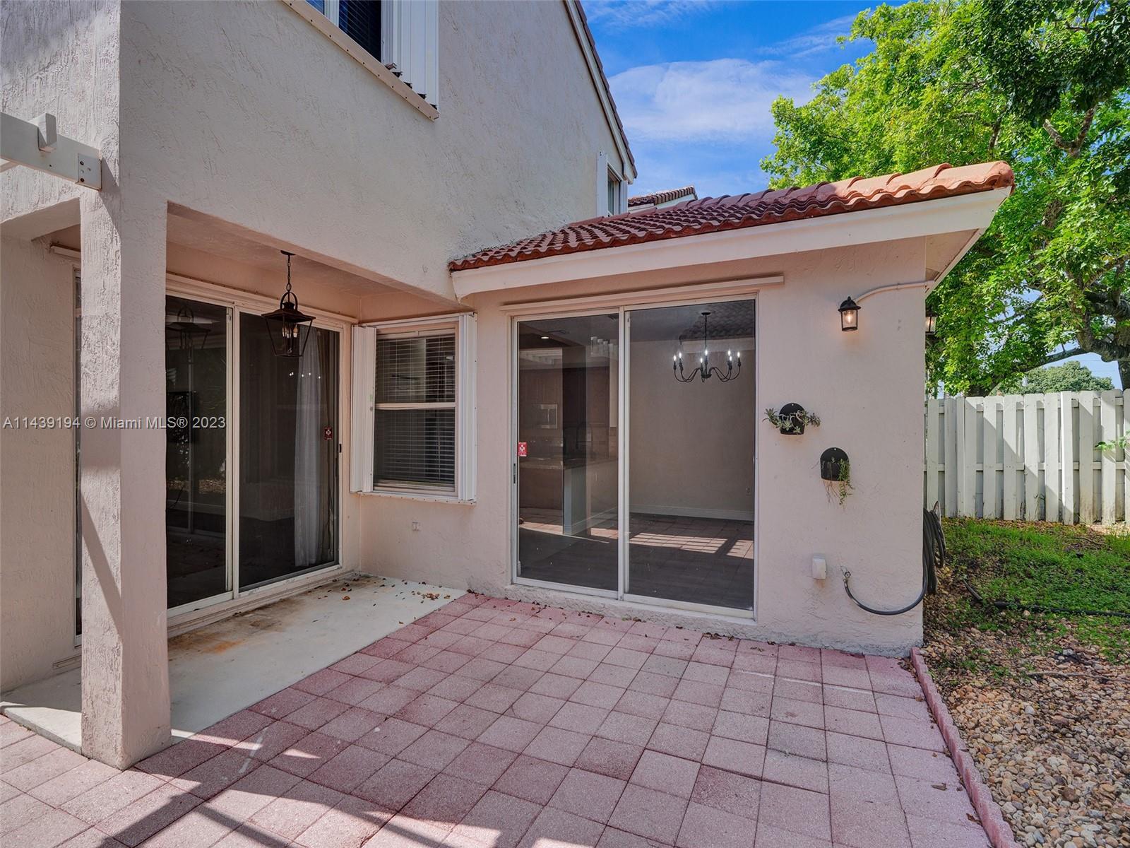 4185 Tree Top Road Cooper City, FL 33026 - Photo 30 of 36 a entryway view with a outdoor space