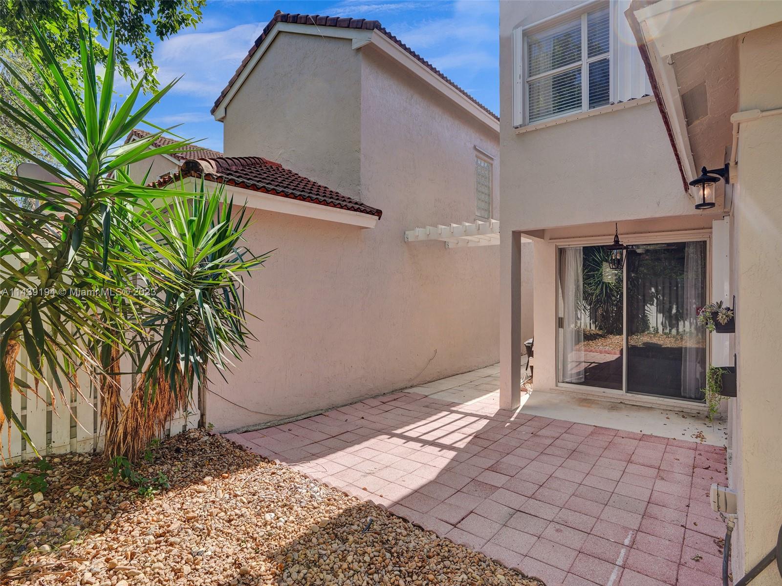 4185 Tree Top Road Cooper City, FL 33026 - Photo 31 of 36 a house view with a outdoor space