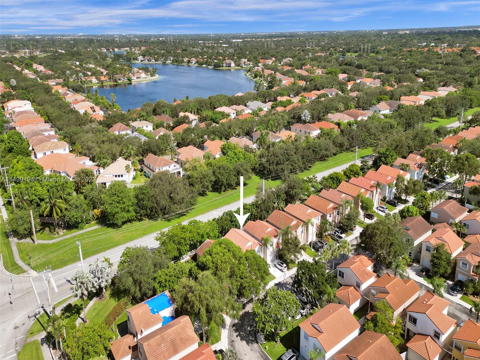 4185 Tree Top Road Cooper City, FL 33026 - Photo 33 of 36 an aerial view of residential houses with outdoor space and river