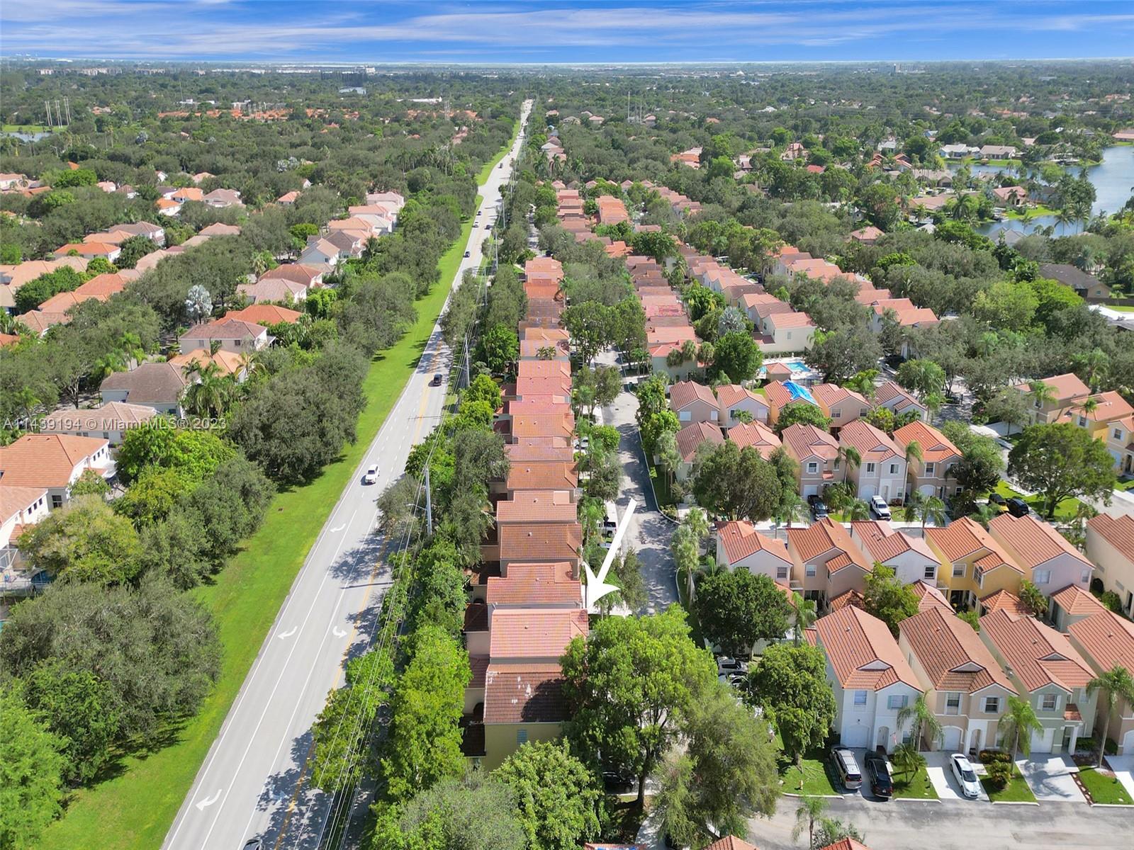 4185 Tree Top Road Cooper City, FL 33026 - Photo 34 of 36 an aerial view of residential houses with outdoor space