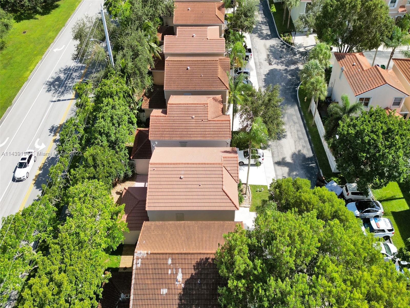 4185 Tree Top Road Cooper City, FL 33026 - Photo 35 of 36 an aerial view of a house with garden space and street view