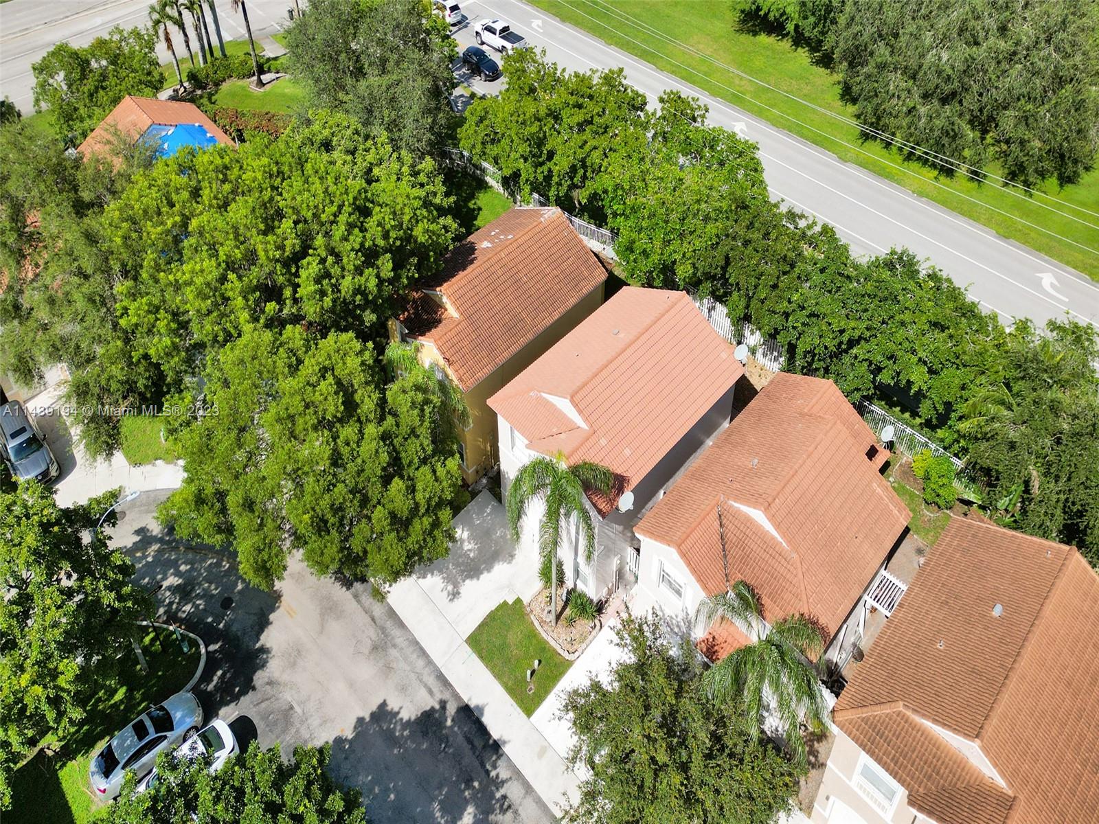 4185 Tree Top Road Cooper City, FL 33026 - Photo 36 of 36 an aerial view of a house with a yard and outdoor seating