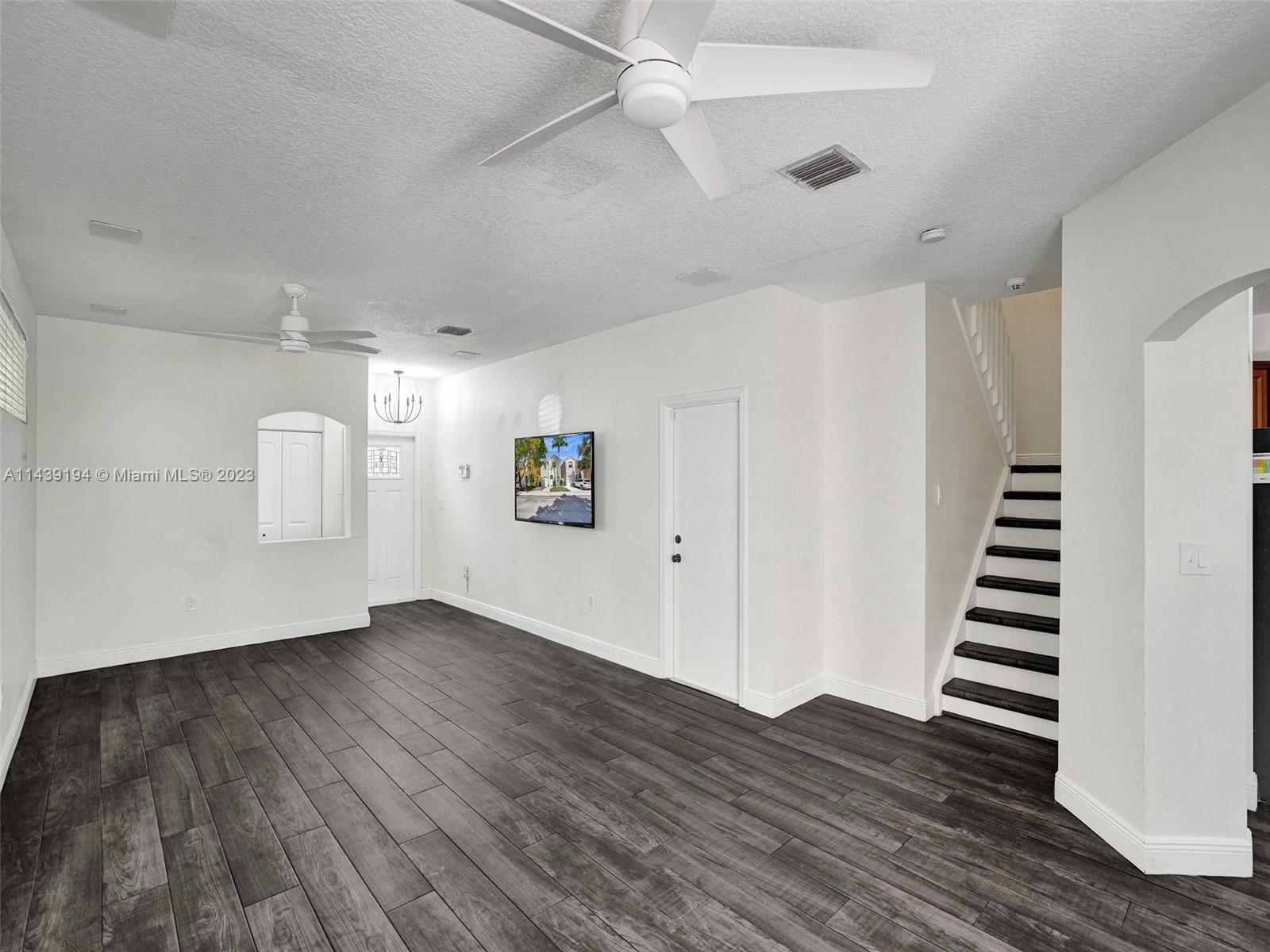 4185 Tree Top Road Cooper City, FL 33026 - Photo 9 of 36 wooden floor in an empty room