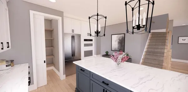 a bathroom with a granite countertop sink and a refrigerator