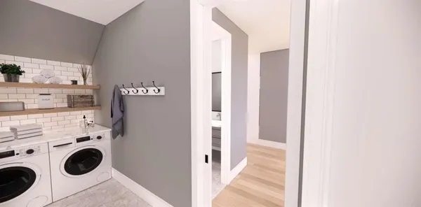 a view of a kitchen with washer and dryer