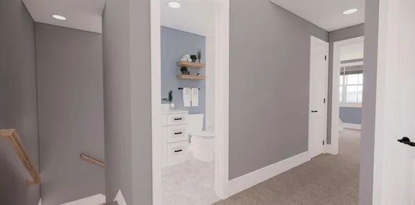 a bathroom with a toilet sink and mirror