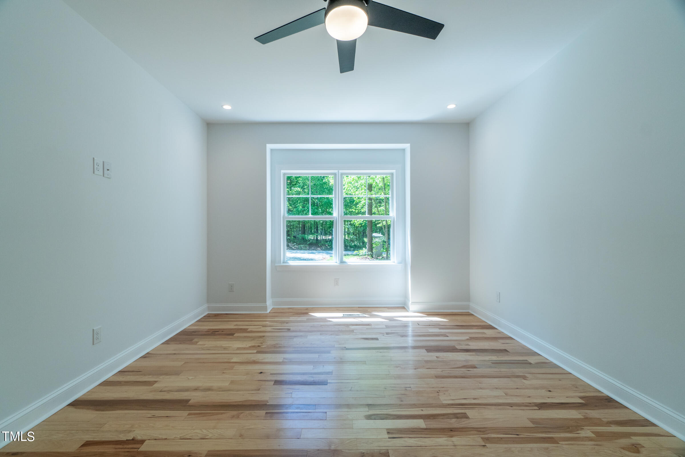 206 Goose Lane Mebane, NC 27302 - Photo 18 of 37 a view of an empty room with wooden floor and a window