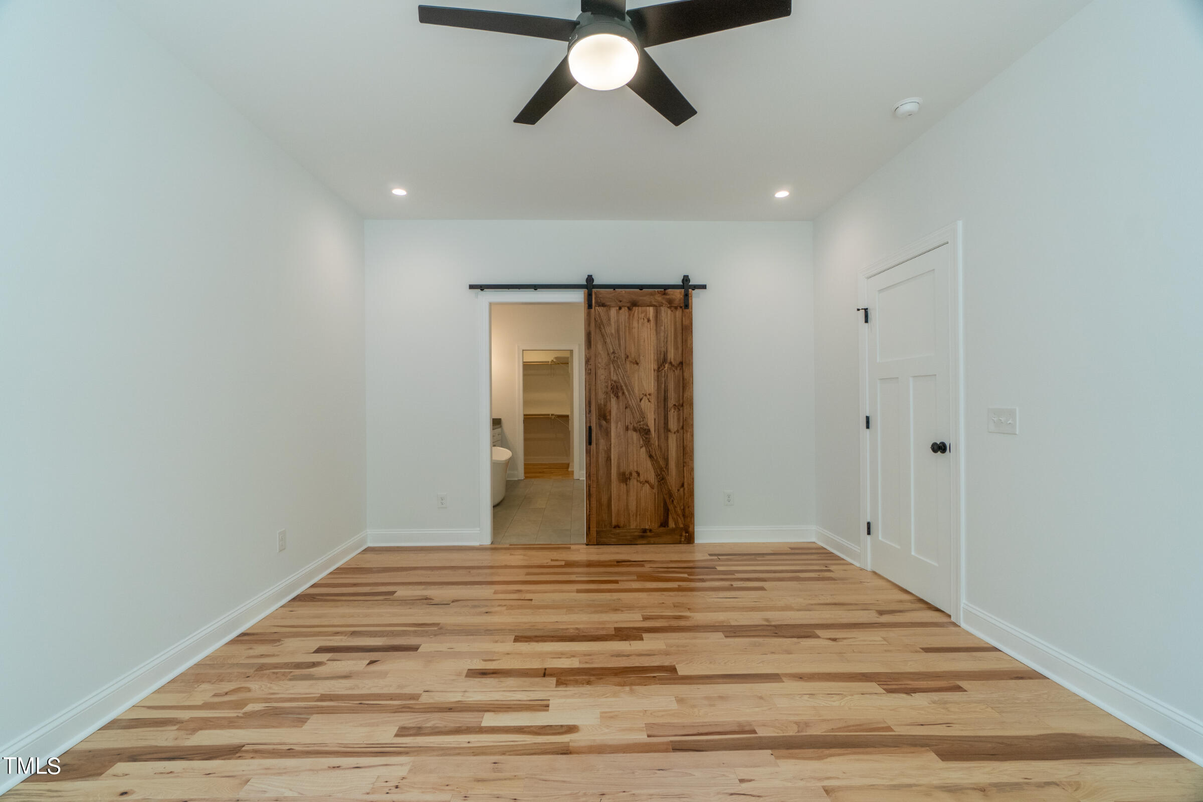 206 Goose Lane Mebane, NC 27302 - Photo 19 of 37 a view of empty room with wooden floor and ceiling fan