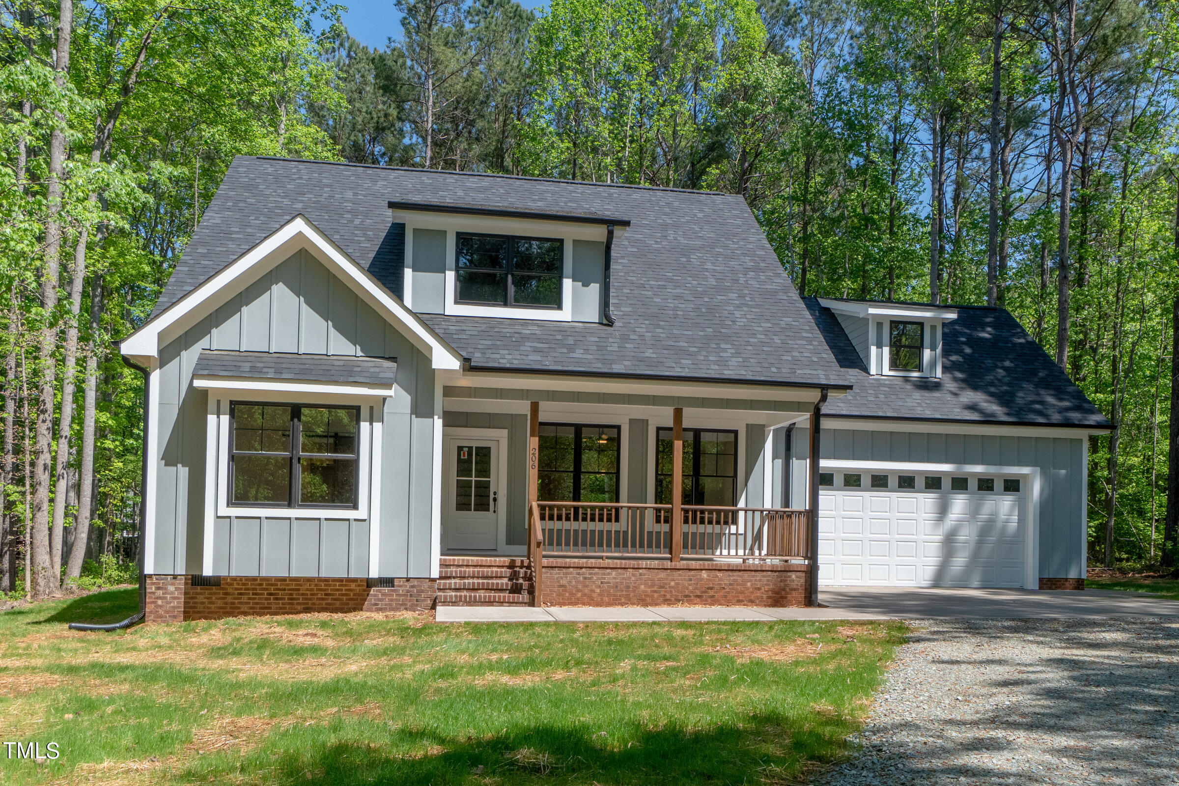 206 Goose Lane Mebane, NC 27302 - Photo 2 of 37 a front view of a house with a yard