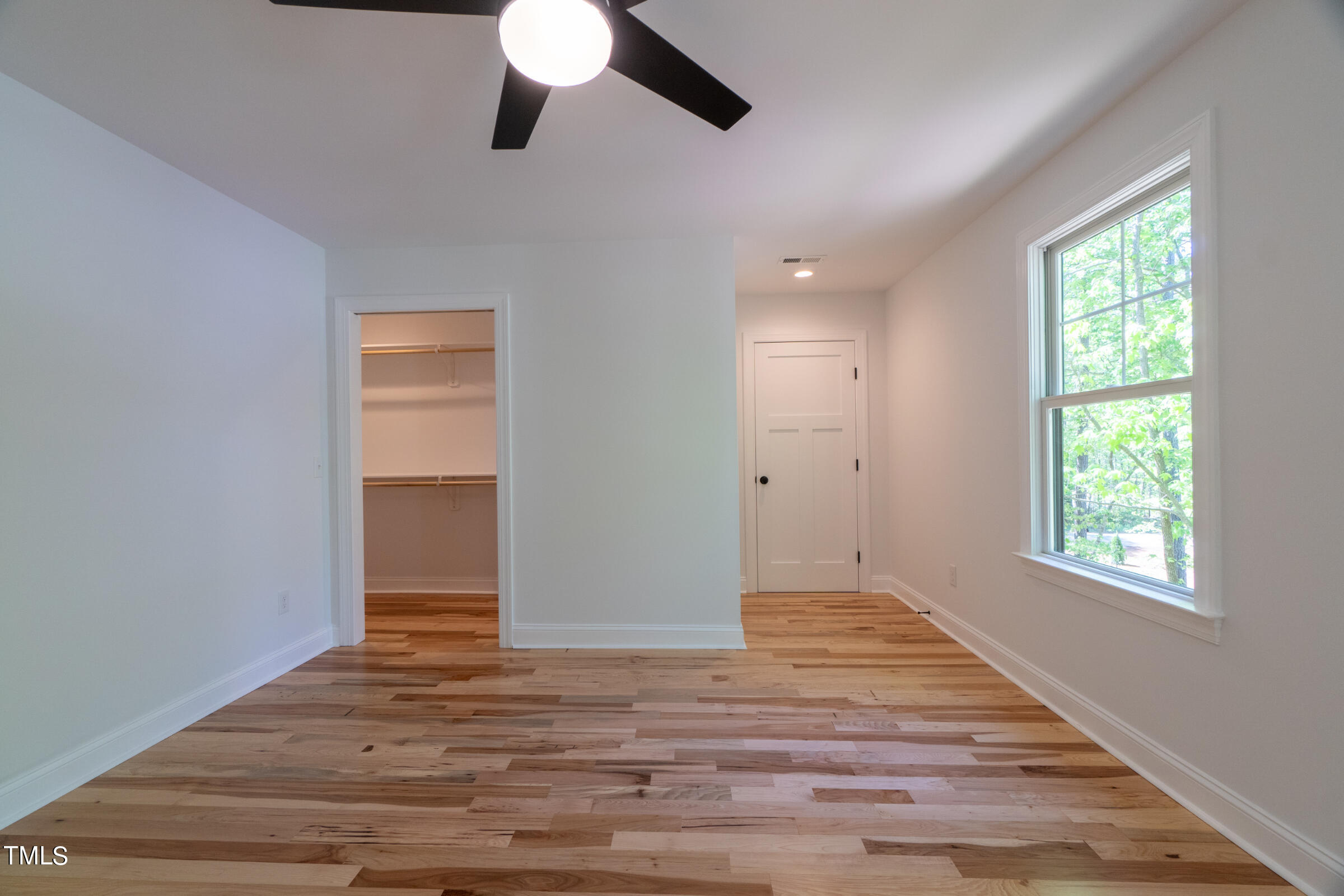 206 Goose Lane Mebane, NC 27302 - Photo 26 of 37 an empty room with wooden floor cabinet and windows