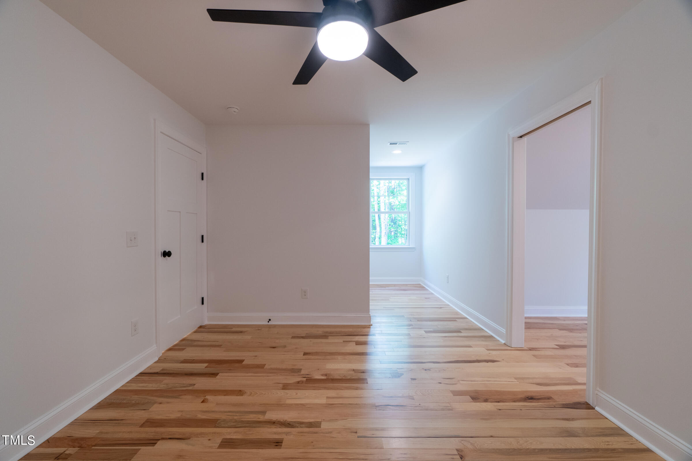 206 Goose Lane Mebane, NC 27302 - Photo 31 of 37 a view of empty room with window and wooden floor