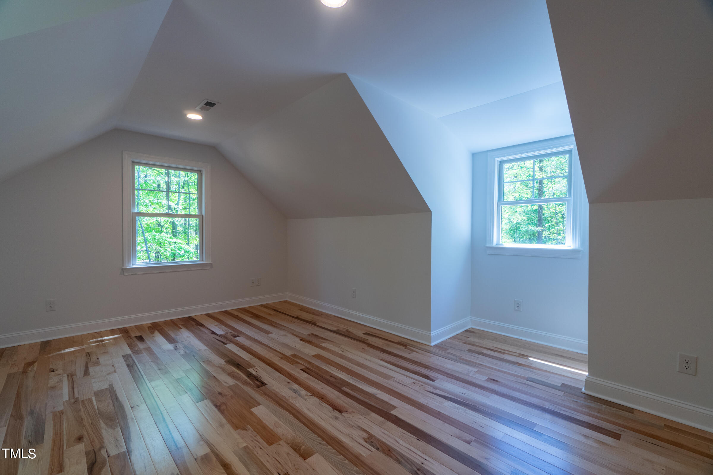 206 Goose Lane Mebane, NC 27302 - Photo 34 of 37 an empty room with wooden floor and windows