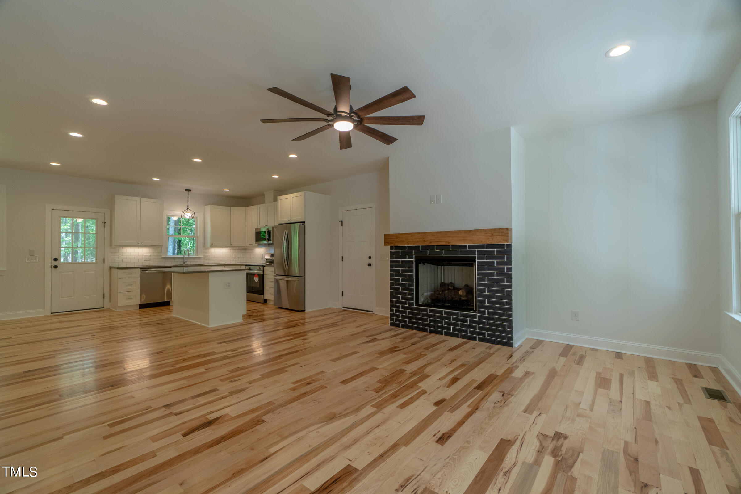 206 Goose Lane Mebane, NC 27302 - Photo 8 of 37 a view of a kitchen with a sink and a fireplace