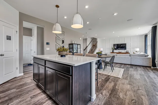 a kitchen with a sink a counter space appliances and cabinets