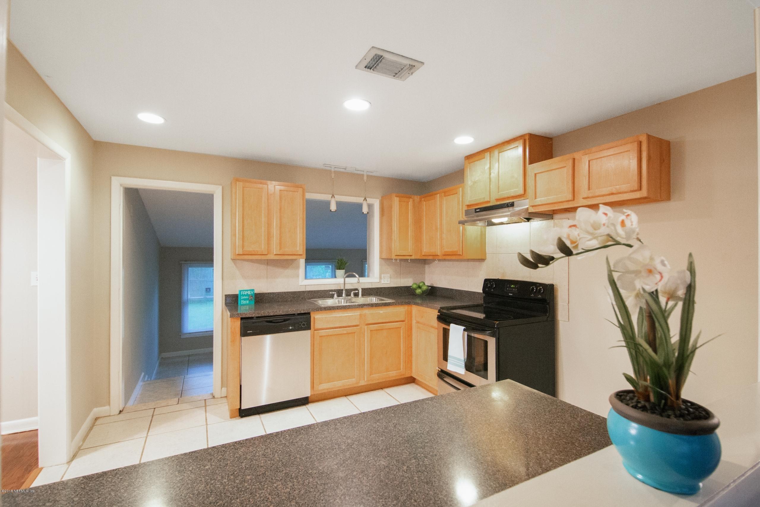 6157 Harvin Road Jacksonville, FL 32216 - Photo 9 of 29 Kitchen Looking Through Pass Through