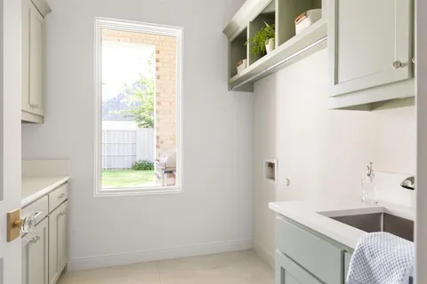 a bathroom with a tub sink and window