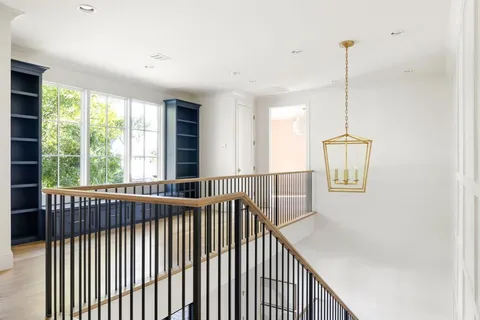 a view of a hallway with windows