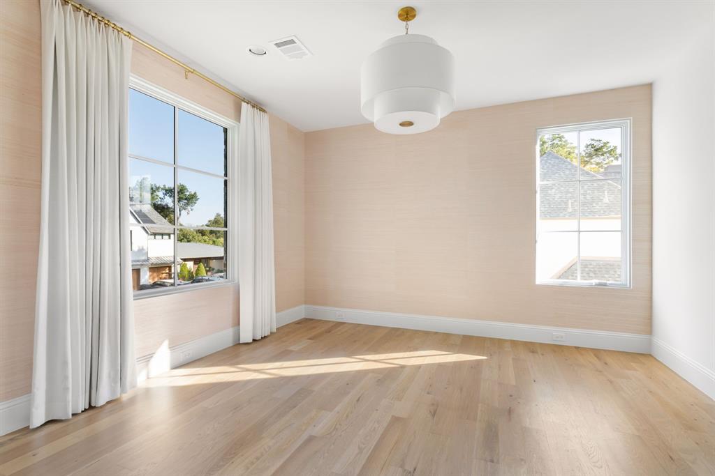 6541 Oriole Drive Dallas, TX 75209 - Photo 22 of 31 wooden floor in an empty room with a window