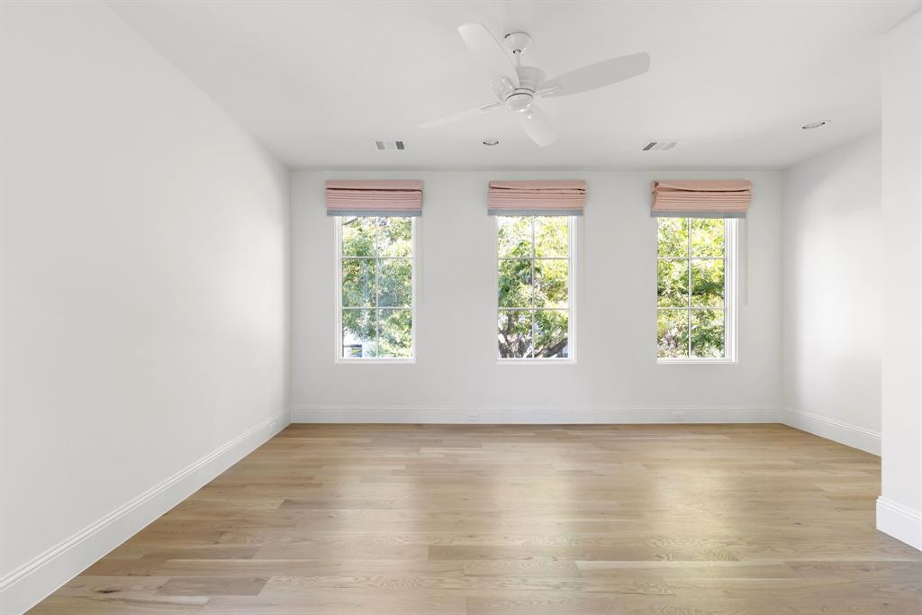 6541 Oriole Drive Dallas, TX 75209 - Photo 24 of 31 an empty room with wooden floor and windows