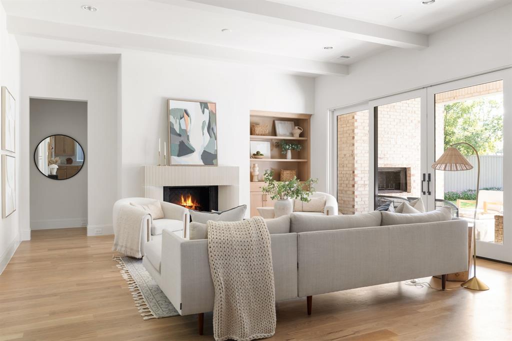 6541 Oriole Drive Dallas, TX 75209 - Photo 5 of 31 a living room with furniture a fireplace and a large window