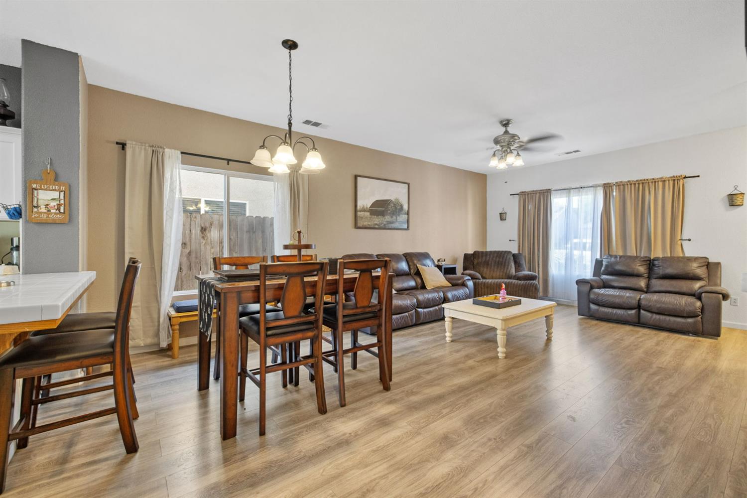 1963 West Merritt Street Hanford, CA 93230 - Photo 13 of 32 a view of a a dining room with furniture window and wooden floor