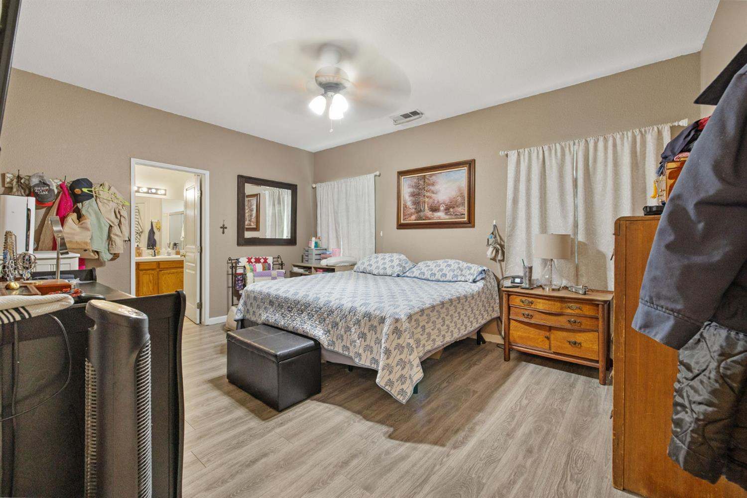 1963 West Merritt Street Hanford, CA 93230 - Photo 19 of 32 a bedroom with a bed furniture and a flat tv screen