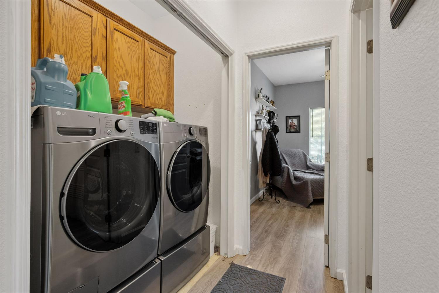 1963 West Merritt Street Hanford, CA 93230 - Photo 23 of 32 a utility room with dryer and washer