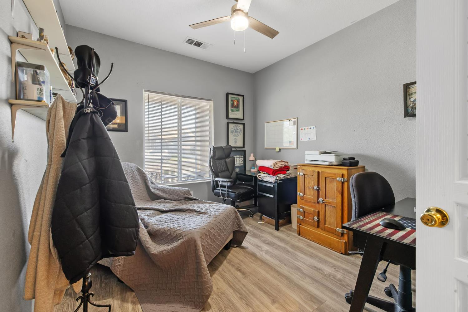 1963 West Merritt Street Hanford, CA 93230 - Photo 26 of 32 a work room with furniture and wooden floor