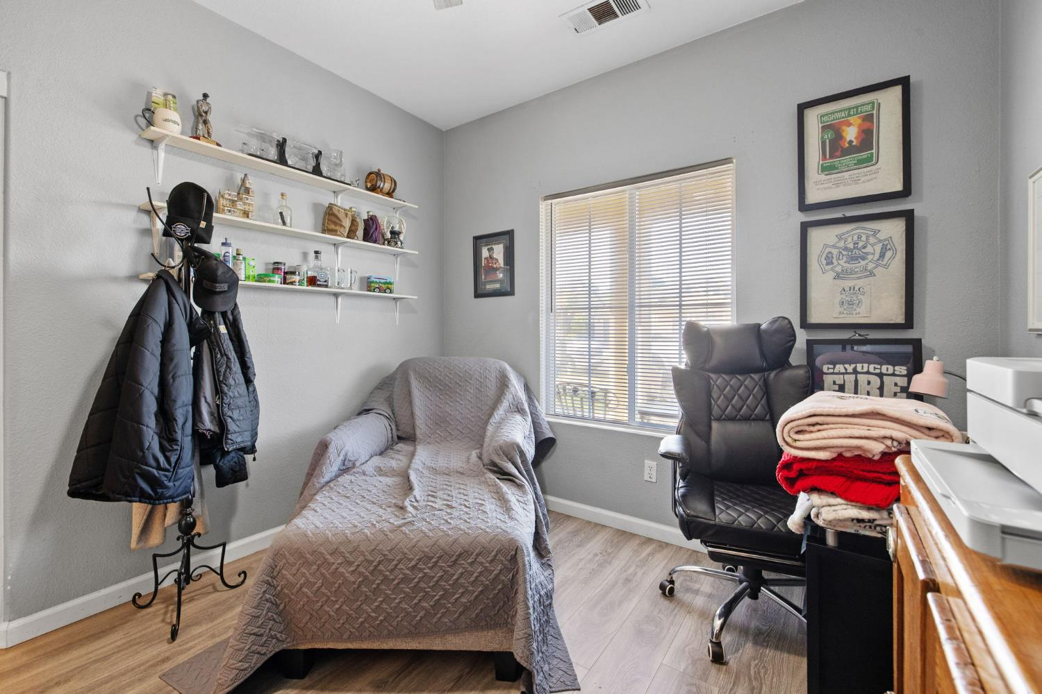 1963 West Merritt Street Hanford, CA 93230 - Photo 27 of 32 a bedroom with furniture and a window