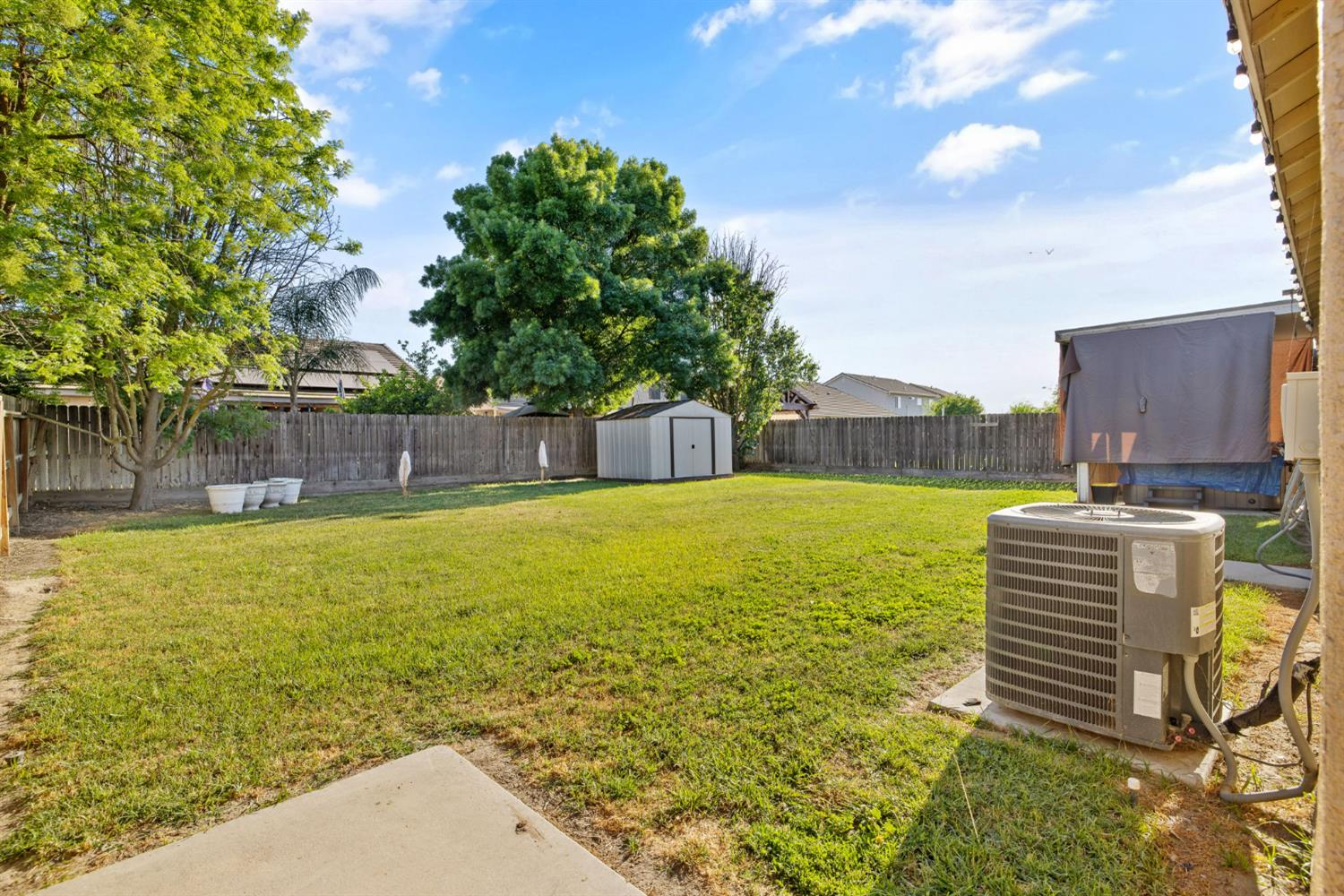 1963 West Merritt Street Hanford, CA 93230 - Photo 28 of 32 a view of a swimming pool with a yard
