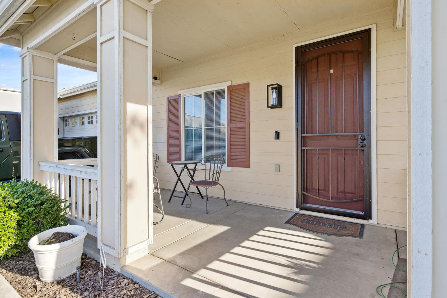 1963 West Merritt Street Hanford, CA 93230 - Photo 5 of 32 a view of front door and porch with dining area