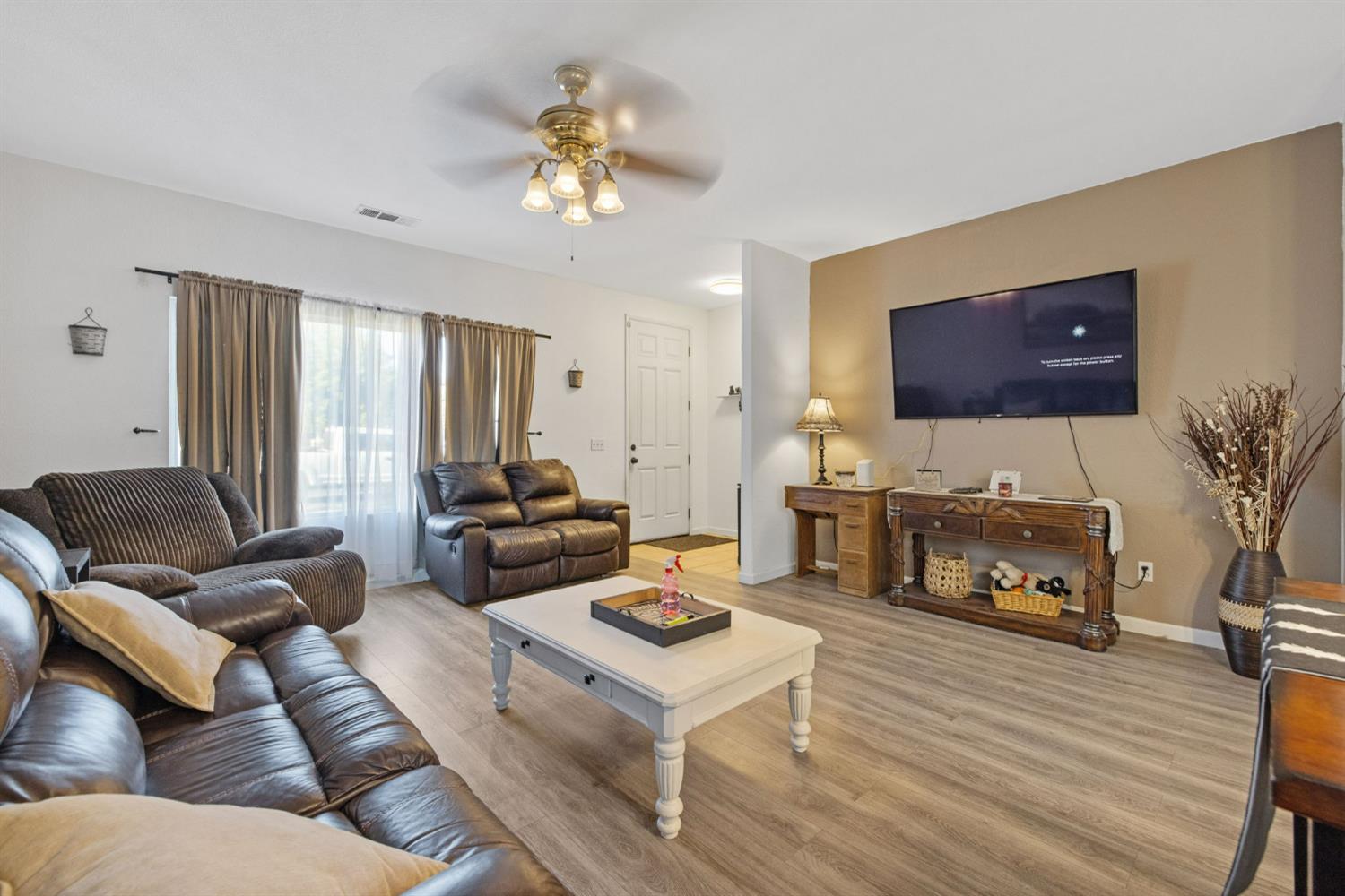 1963 West Merritt Street Hanford, CA 93230 - Photo 9 of 32 a living room with furniture and a flat screen tv