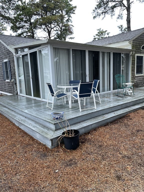 20 Lawrence Road Dennis Port, MA 02639 - Photo 21 of 29 a view of a house with backyard and sitting area