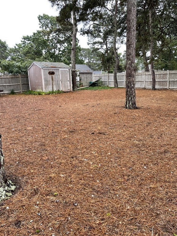 20 Lawrence Road Dennis Port, MA 02639 - Photo 25 of 29 a view of a backyard with trees