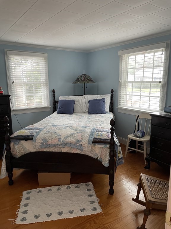 20 Lawrence Road Dennis Port, MA 02639 - Photo 5 of 29 a bedroom with a bed and wooden floor
