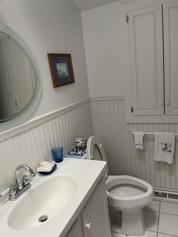20 Lawrence Road Dennis Port, MA 02639 - Photo 8 of 29 a bathroom with a sink a toilet and mirror