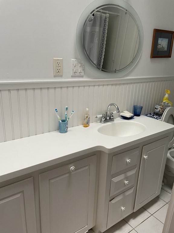 20 Lawrence Road Dennis Port, MA 02639 - Photo 9 of 29 a kitchen with a sink and a mirror