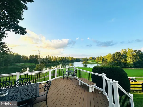 a large kitchen with stainless steel appliances granite countertop a large stove a sink and a refrigerator