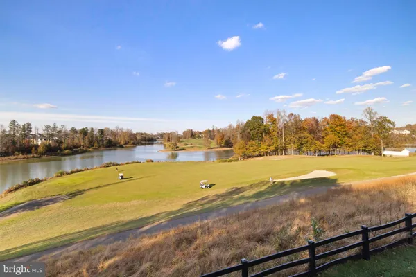 a view of a sink and a large window in an empty room