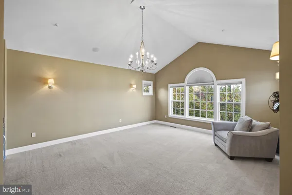 a view of a large counter top space and stainless steel appliances
